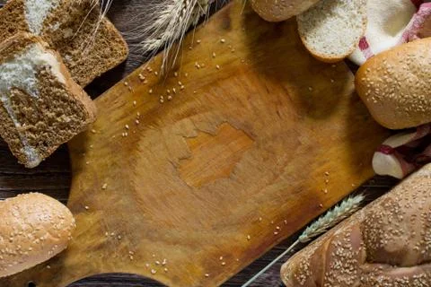 The different whole wheat bread, baked in the home, organic ingredients. Stock Photos