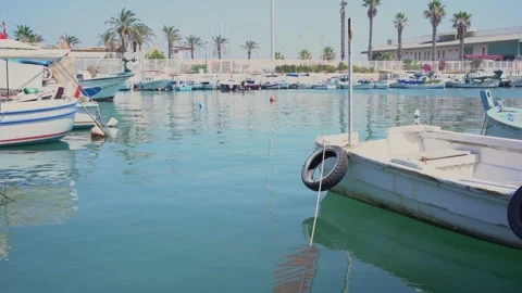 Different yachts and motorboats drift on calm sea water Stock Footage 157448832