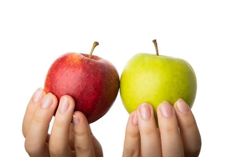 Differentiation, selection and comparison of red and green apples. Stock Photos
