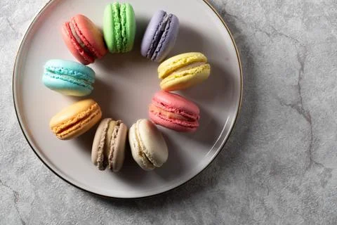 Differnt color macaroons on a plate Stock Photos