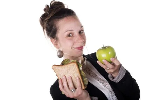 Difficult choice between cake and apple Stock Photos