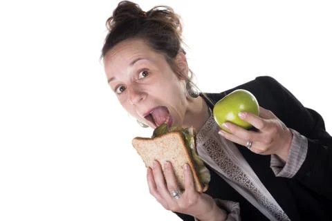 Difficult choice between cake and apple Stock Photos