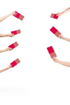 Difficult choice. It is a lot of different offers. Many hands holding the red Stock Photos