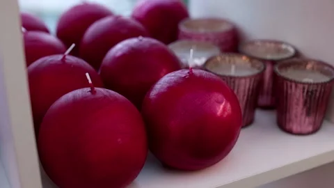 Difficult choice with a variety of interior items shelves. Candles close-up. Stock Footage 143882599