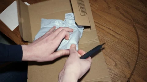 Difficult Plastic Parcel Unboxing 库存影片 304620132