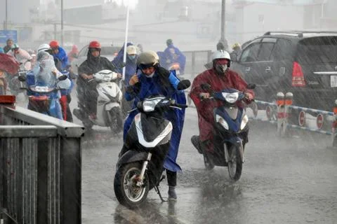 Difficult ride motorcycle in storm Stock Photos
