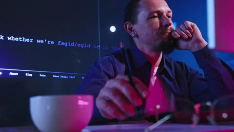 Difficult task. Concentrated man, employee, programmer writing software code Stock Footage 245344247