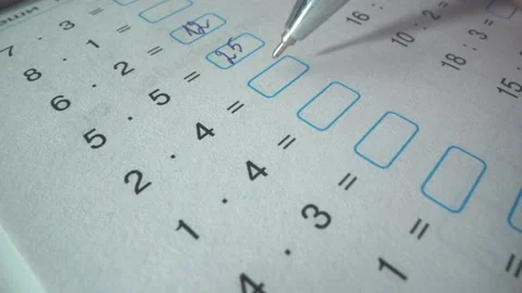 Difficult task on the math exam. student solves equations. he writes the correct Video stock 141185328