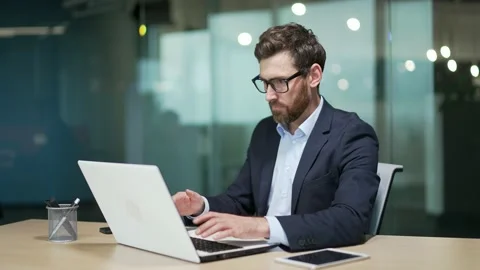 Difficulties are problem working with software on a laptop business man employee Stock Footage 234159267