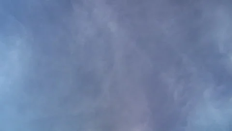 Diffuse clouds and jet vapor trail move in time-lapsed motion. Stock Footage 147844991