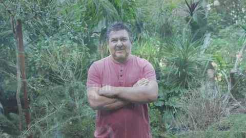 Diffuse daylight brightening senior man standing center shifting arms and Stock Footage 332285303