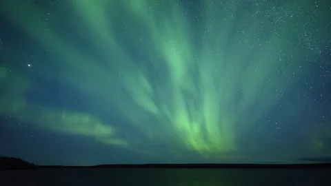 Diffuse flashing Northern Lights on starry sky Stock Footage 250289530