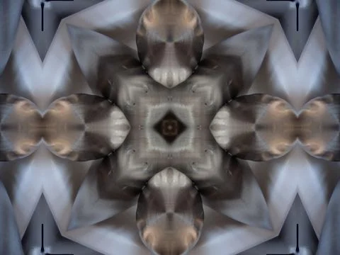 A diffuse kaleidoscope repeat pattern of reflective metal surfaces for wallpaper 스톡 사진