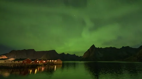 Diffuse Northern Lights over coast landscape Stock Footage 250816862