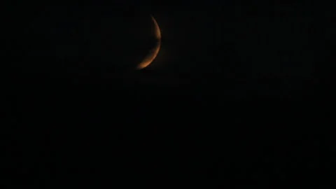 Diffuse silhouette of crescent in stormy night Stock Footage 113518666
