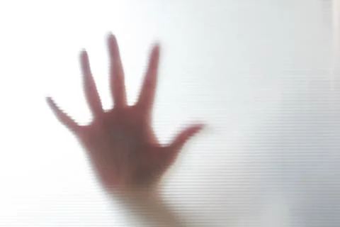 Diffused silhouette of female hands through plastic Stock-Fotos