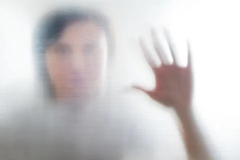 Diffused silhouette of female hands, view with shadow through plastic Stock-Fotos