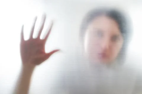 Diffused silhouette of female hands, view with shadow through plastic Stock-Fotos