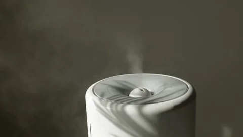 Diffuser, air purifier or humidifier releases strong stream of cold steam oil Stock Footage 238486513