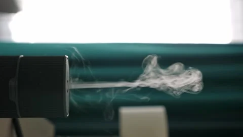 Diffuser diffusing steam in apartment room. Vertical footage Video stock 254128722