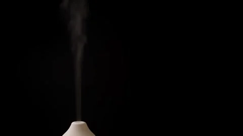 Diffuser diffusing steam on black background Video stock 240479490