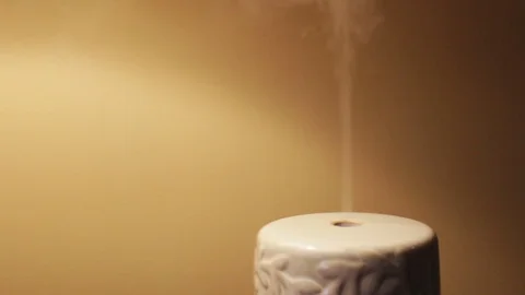 Diffuser shooting scented fragrance in ambient setting Stock Footage 71474769