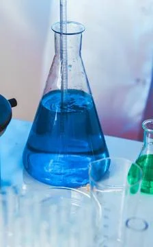 Diffusion in the flask Scientist shows a diffusion in the flask ,model rel... Stock Photos