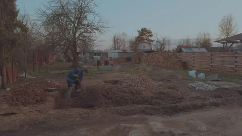 To dig the earth, to dig up garbage from the ground 스톡 동영상 332932890