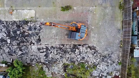 Digger breaking up concrete 2.7k SDR Stock Footage 318536359