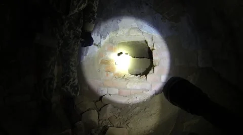 Digger breaks the wall in the catacombs in Izmail. Stock Footage 58182865