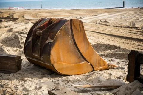 Digger Bucket at the sea Stock Photos