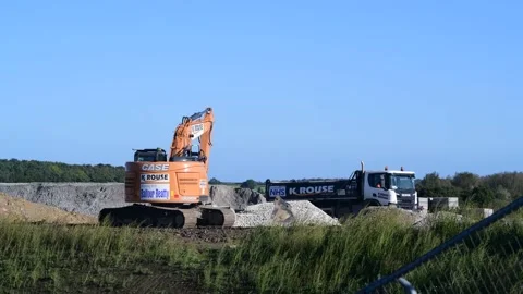 Digger changing attachment on arm united kingdom Stock Footage 213561411