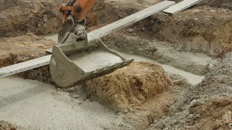 Digger Claw Drops Cement Into House Foundation Slow Motion 스톡 동영상 239759386
