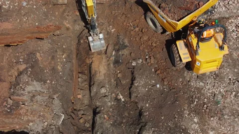 Digger Digging Foundations Of House Whilst Dirt Carried Away Video stock 239698184