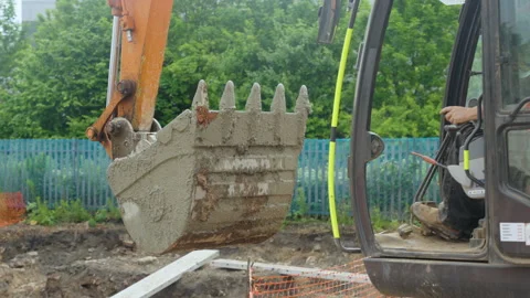 Digger Drops Cement Into House Foundations On Building Site Video stock 239759515