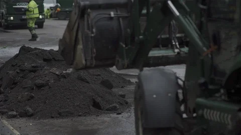 Digger excavating and moving earth. Building Site with workman. Stock Footage 93207674