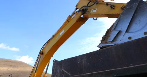 Digger loading track with soil (4K) Stock Footage 166843493