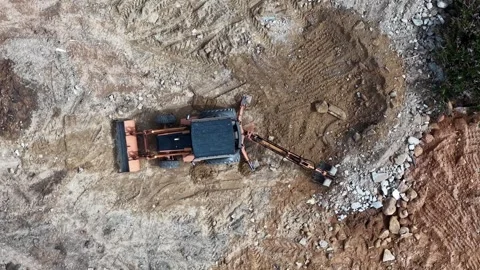 Digger moves dirt with heavy arm Stock Footage 338002714