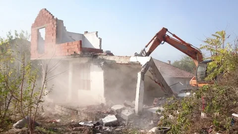 Digger Using Its Bucket To Demolish House. Stock Footage 91649516
