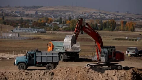 Digger is working and loading tracks Stock Footage 167052789