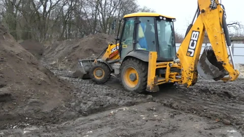 Digger working  in the mud and clearing 4k video footage. Stock Footage 169752845