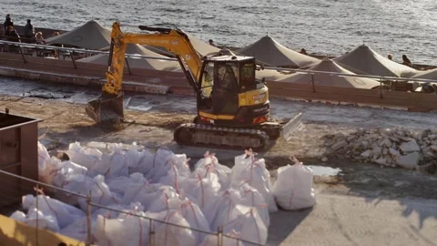 A digger working next to Sydney harbour tilt shift slow motion 4K Stock Footage 201644058