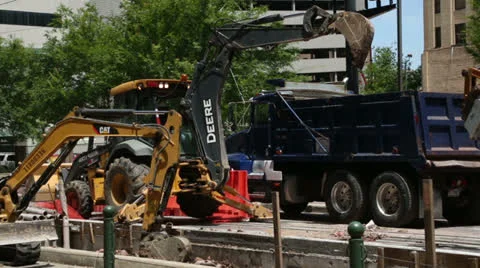 Diggers and construction workers, houston Stock Footage 24651535