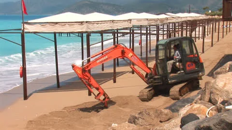 Digging  on the beach Stock Footage 24232975