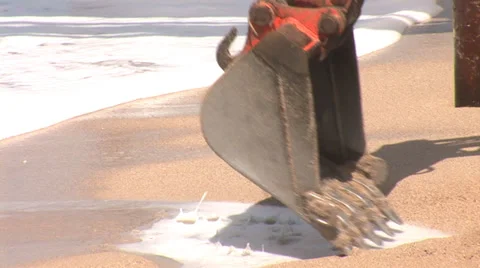 Digging  on the beach Stock Footage 24233764