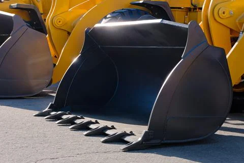 Digging bucket of an excavator, loader or bulldozer Stock Photos