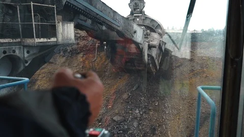 Digging clay with a large excavator in a coal mine. view from the cabin Stock Footage 106887717