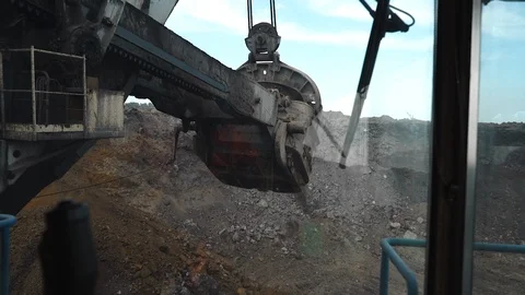 Digging clay with a large excavator in a coal mine. view from the cabin Stock Footage 106914172