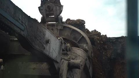 Digging clay with a large excavator in a coal mine. view from the cabin Stock Footage 106914452
