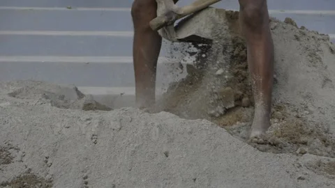 Digging into Construction - A Dusty Day of Digging with a Shovel Stock Footage 324033055